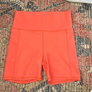 Vuori Women's Athletic Shorts - Bright Orange